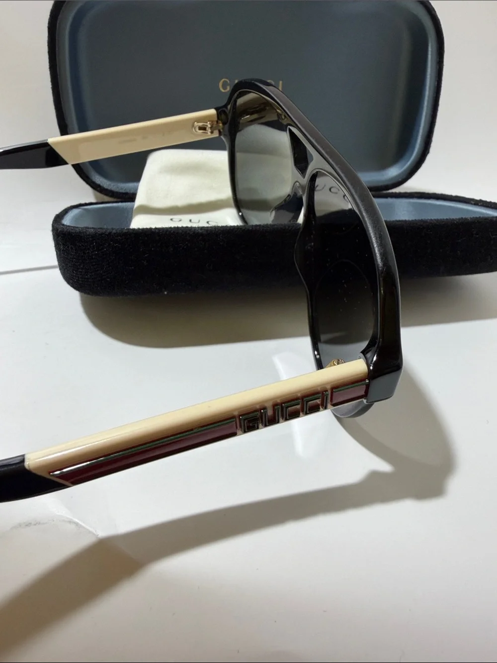 Gucci Men’s Black Sunglasses with Gold and Red Temple Accent